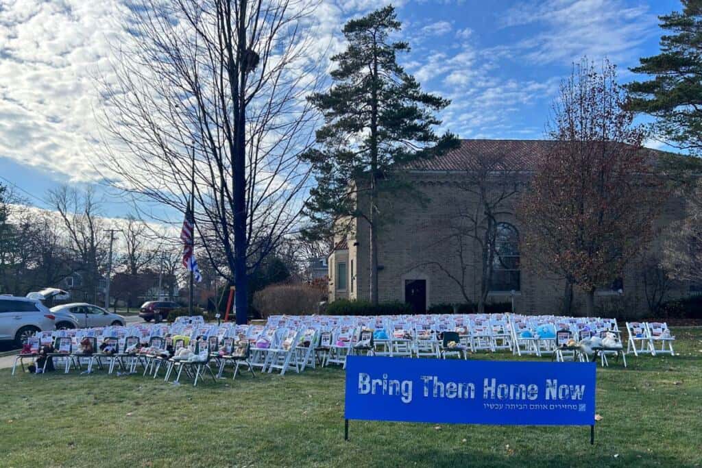 The Am Shalom chair installation for hostages and Hope Tree in daylight